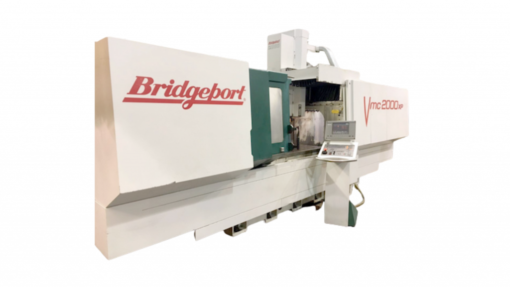 Large industrial Bridgeport CNC machine on a white background
