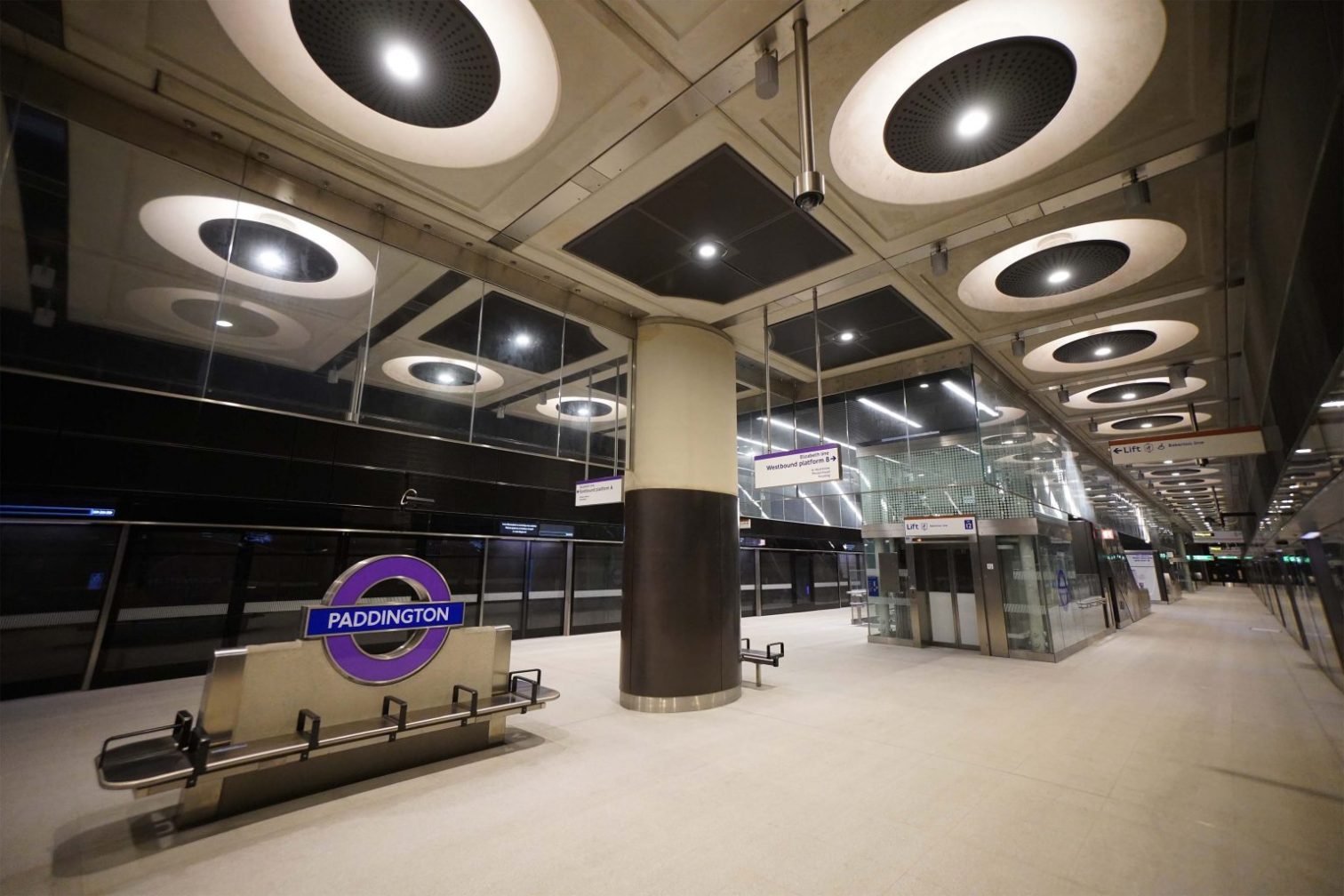 Lots of LED lights at Paddington train station, purple Paddington station sign