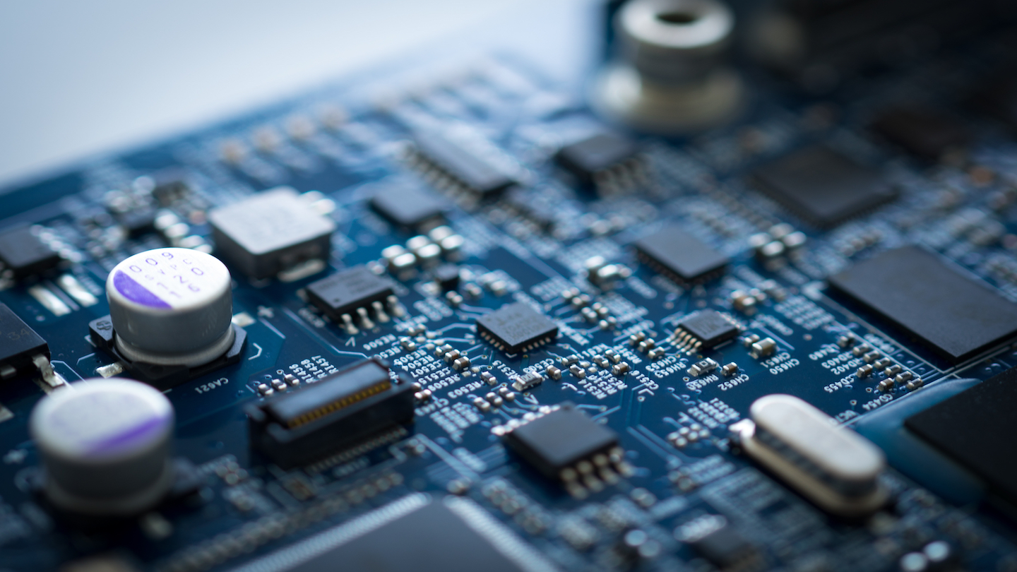 A selection of semiconductors including discrete diodes, thyristors, MOSFETs and IGBTs on a blue circuit board