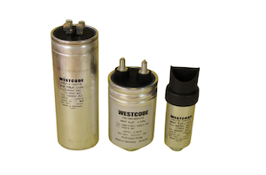 IXYS UK Westcode gold and black capacitors standing upright