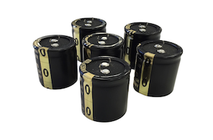 Black and gold low temperature capacitors