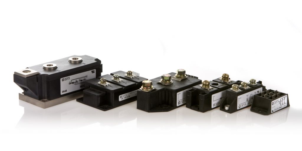 Black and white diode and thyristor modules stacked side by side on a white background.